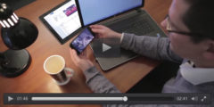 screenshot of a paused video, man watching a CitNOW workshop video on his mobile phone sat at his desk